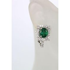 This is part of Chairish’s Fine Jewelry assortment.  Emerald Diamond Earrings  These gorgeous handmade earrings features two genuine earth mined untreated oval cut emeralds of approximately 5.83 carats. These emeralds has a lovely color of green and unaided by magnification is clean and transparent to the naked eye. Surrounding the emerald are diamonds of approx. 2.19 carats. The Diamonds are G in color and are VS to SI in clarity. Total weight for these earrings is 4.2 grams. These earring were Green Oval Diamond Earrings For Wedding, Oval Emerald Earrings For Anniversary, Green Oval Diamond Earrings, Fine Jewelry Oval Emerald Earrings, Oval Emerald Gemstone Earrings, Oval Emerald Earrings With Prong Setting, Oval Emerald Earrings For May Birthstone, Emerald Oval Earrings For May Birthstone, Exquisite Green Earrings With Prong Setting