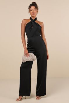 The Lulus Beyond Classy Black Satin Halter Wide-Leg Jumpsuit is perfect for a night of bubbly and dancing! Sleek woven satin shapes this sensational jumpsuit that has a halter neckline (with button closures) and a sleeveless, cross-front bodice with a flirty keyhole cutout at the front and a sexy backless design. The fitted waist tops trendy, wide pant legs that fall to ankle-length hems. Hidden back zipper/clasp. Fit: This garment fits true to size. Length: Floor length. Size medium measures 66 Black Bridesmaid Pantsuit, Glamorous Halter Neck Jumpsuit For Night Out, Chic Halter Neck Jumpsuits And Rompers For Party, Glamorous Halter Neck Jumpsuits And Rompers, Glamorous Halter Neck Jumpsuit, Chic Halter Neck Jumpsuit For Night Out, Chic Halter Neck Jumpsuits And Rompers For Night Out, Elegant Halter Neck Jumpsuits And Rompers For Party, Black Strapless Halter Neck Jumpsuit For Night Out