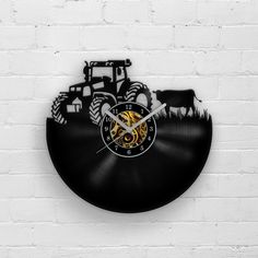 a vinyl record clock with an image of a tractor on it