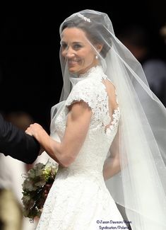 the bride and groom are smiling at each other