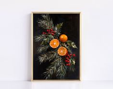 a painting with oranges, holly and pine cones on a black background is displayed in a gold frame