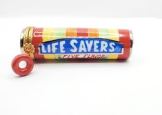 "Ultra-RARE lifesaver design features a realistic design full of vibrant colors.  Inside is a removable lifesaver candy (it's not actual size it's smaller to fit safely into the tube).  This is HUGELY RARE & close to impossible to obtain.   These are no longer being produced by Artoria and RARELY seen on the secondary market or auctions. I only have 1 Measures Approx. 3\" Long by 1\" diameter. Signed Artoria  \"Peint Main, Limoges France\"   SPECIAL OCCASION / HOLIDAY PACKAGING IS AVAILABLE FOR Life Savers Candy, Lifesaver Candy, Polymer Clay Miniatures, Peppermint Candy, Life Savers, Knick Knacks