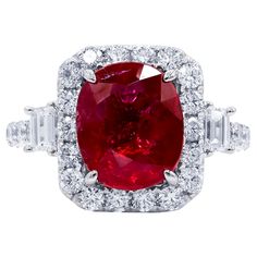 18kt White Gold Diamond Halo Ruby Ring: 4.00ct GIA certified oval cut ruby 1.75cts of baguette and round diamonds on the side Size 6 Radiant Cut Diamond Ring, Ruby Diamond Ring, Diamond Rings With Price, Contemporary Engagement Rings, Cool Wedding Rings, Ruby Diamond Rings, Unique Diamond Rings, Bridal Ring Sets, Ring With Diamond