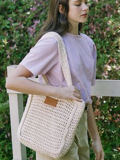 NONLACAL reinterprets the classic mood and pursues a timeless design that can be kept for a long time with a silhouette and sensitive materials that capture natural beauty in everyday life.- Durable 100% cotton used bag- Minimal square shape knit shoulder bag- Includes a set of internal pouches- Wide shoulder strap for a comfortable fit Casual Square Canvas Bag For Everyday, Casual Square Canvas Bag, White Rectangular Crochet Bag For Day Out, Casual Neutral Crochet Bag Rectangular, Rectangular Natural Shoulder Bag For Everyday, Casual Cream Crochet Bag For Everyday, Eco-friendly Square Shoulder Bag For Everyday, Natural Rectangular Shoulder Bag For Everyday, Eco-friendly Rectangular Shoulder Bag For Day Out