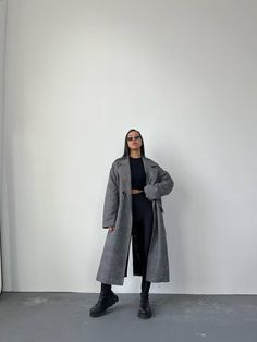 Step out in style with our Vintage Style Grey Classic Trench Coat, designed for the modern woman who appreciates both comfort and elegance. This long trench winter coat is crafted from high-quality vegan wool, ensuring warmth and durability for those chilly days. Featuring an oversized fit, this coat allows for easy layering over your favorite outfits, making it a versatile addition to your winter wardrobe.  Perfect for any occasion, this coat for women is not just about functionality; it's a fa Oversized Gray Sweater Coat For Work, Oversized Solid Wool Coat For Cold Weather, Trendy Oversized Pea Coat For Winter, Oversized Trendy Winter Pea Coat, Oversized Gray Wool Coat With Long Sleeves, Oversized Gray Long Sleeve Wool Coat, Trendy Oversized Sweater Coat For Work, Oversized Gray Wool Coat For Fall, Gray Oversized Wool Coat For Fall