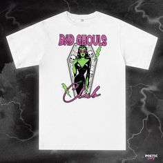 Arise from your spooky slumber and join our Bad Ghouls Club. Available in a variety of printed colours. (Check out our limited edition Lime Green t-shirt print limited to a 25 print run!) For sizing, please refer to the Unisex size guides pictured. UK - Size guide. XS - 3XL (100% organic cotton tee) USA - Size Guide. XS - 3XL (100% soft ringspun cotton tee) White Grunge T-shirt For Halloween, White Pop Culture T-shirt For Halloween, White Horror T-shirt With Letter Print, Green Halloween T-shirt For Streetwear, Spooky Graphic Print T-shirt For Streetwear, Unisex Halloween T-shirt With Screen Print, Spooky Graphic Print T-shirt For Fans, Black Spooky Graphic T-shirt, White Halloween T-shirt With Front Print