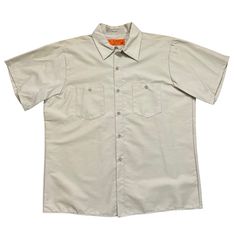 This Item Is A Vintage Universal Overall Short Sleeve Workshirt. Made In Chicago, Il. Khaki Tan. Durable Press. In Unworn Condition. Tag Size. L With Measurements In The Pictures. Short Sleeve Khaki Shirt For Work, Khaki Cotton Collared Shirt, Khaki Short Sleeve Shirt With Button Closure, Classic Beige Cotton Short Sleeve Shirt, Khaki Cotton Shirt With Camp Collar, Classic Khaki Short Sleeve Tops, Khaki Short Sleeve Top With Pockets, Khaki Cotton Collared Short Sleeve Shirt, Classic Beige Short Sleeve Shirt