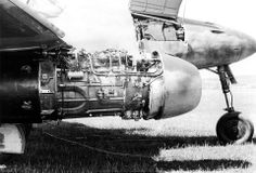 an old airplane is sitting in the grass with its engine on it's side