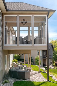 the back side of a house with an outside patio