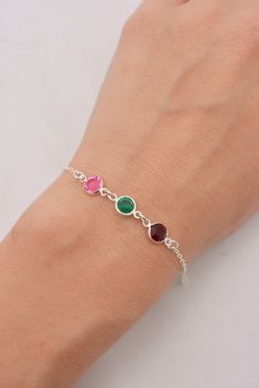 NEED RUSH SHIPPING? ADD UPGRADED SHIPPING: www.etsy.com/listing/247157508/rush-order-shipping-upgraded-to-usps? This beautiful bracelet makes a wonderful gift for a mother or grandmother. Choose up to 10 different birthstones on your custom-made bracelet. I hand-make this using quality sterling silver chain and lobster clasp. The lovely Swarovski crystals are available in your choice of birthstone colors (5th photo) and measure approximately 6mm across. Birthstones will be placed on the bracelet Adjustable Sterling Silver Bracelet With Birthstone For Anniversary, Sterling Silver Birthstone Bracelet Gift, Hypoallergenic Sterling Silver Name Bracelet For Mother's Day, Personalized Sterling Silver Bracelet For Mom, Personalized Sterling Silver Bracelets As Gift For Mom, Sterling Silver Birthstone Bracelet For Anniversary, Sterling Silver Bracelet For Mother's Day Gift, Sterling Silver Round Bracelet With Birthstone For Anniversary, Silver Sterling Bracelet For May Birthstone