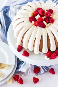 a white chocolate raspberry cake on a plate