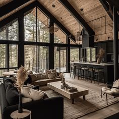 a living room filled with furniture and lots of windows