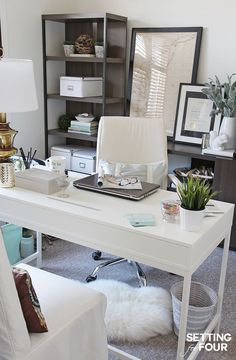 a white desk topped with a laptop computer