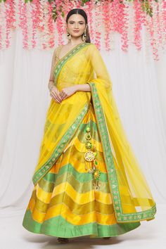 Green, mustard colorblock lehenga with lace embroidery. Paired with mirror embroidered blouse and dupatta.
Component: 3
Pattern: Embroidery
Type Of Work: Lace, mirror
Neckline: V neck
Sleeve Type: Sleeveless
Fabric: Dupion silk
Color: Green,Yellow
Other Details: 
Tassel bordered blouse
Side tassel tie-up
Sheer dupatta
Occasion: Destination Wedding - Aza Fashions Sheer Dupatta, Types Of Work, Luxury Sale, Dupion Silk, Pattern Embroidery, Yellow Lace, Embroidery Lace, Silk Embroidery, Lace Embroidery