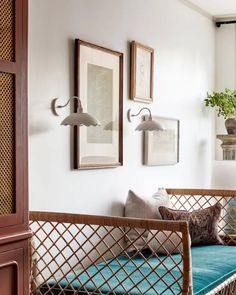 a living room filled with furniture and pictures on the wall