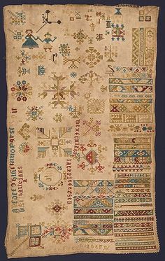 an old rug with many different designs on it