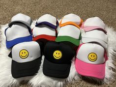 Multiple colors available. The latest trend! Casual Smiley Face Hat With Curved Brim, Trendy White Winter Baseball Cap, Trendy Winter Trucker Hat, Casual Smiley Face Snapback Baseball Cap, Casual Smiley Face Snapback Hat, Trendy Trucker Hat For Summer Streetwear, White Snapback Trucker Hat For Winter, Spring Casual Trucker Hat With Flat Bill, Trendy Winter Snapback Hat For Streetwear