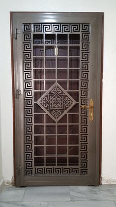 a door with an intricate design on the front and side panels, which are made from metal