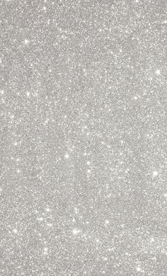 an abstract silver glitter background with small white dots on the top and bottom half of the image