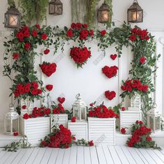 red roses and greenery are arranged on the wall in front of two white benches