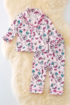 Stay comfortable and stylish while you sleep in our pajama set. Made from 95% polyester and 5% spandex, this fuchsia stripe and white character printed set offers a soft and stretchy fit. Enjoy a quality night's rest in style. Ships 3-5 business days Printed Fitted Sleepwear For Sleepover, Fitted Printed Sleepwear For Sleepover, Playful Pink Printed Sleepwear, Pink Printed Sleepwear, Pink Stretch Bedtime Sets, Playful Hello Kitty Print Sleepwear For Pajama Party, Hello Kitty Print Cotton Loungewear Sets, Cotton Hello Kitty Print Loungewear Sets, Hello Kitty Print Cotton Sleepwear