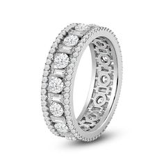 a diamond set wedding ring on a white background