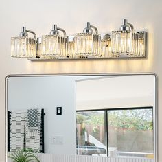 a bathroom with a mirror and lights above it