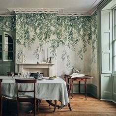 the dining room is decorated in green and white