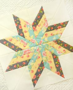 a quilted star with flowers on it