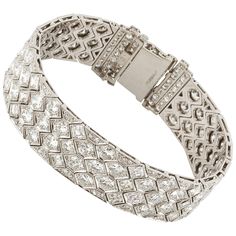 Art Deco platinum honeycomb strap bracelet with round diamonds. Bracelet consists of 24 Asscher cut diamonds totaling 5.0 carats, 59 full cut diamonds totaling 14.50 carats and 152 single cut diamonds totaling 3.25 carats. Total diamond weight is 22.75 carats. Bracelet measures 6 1/2 inches in length and is 5/8 inches wide. Marked on the clasp "10% IRIDPLAT". Circa 1920's. High Jewelry Bracelet, Gold Diamond Watches, Expensive Diamond, Flexible Bracelet, Platinum Bracelet, Expensive Jewelry Luxury, Antique Bracelets, Diamond Jewelry Designs, Jewelry Techniques