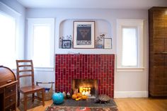 a living room filled with furniture and a fire place in the middle of a room