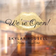 we're open skylarrousel beauty and makeup artist logo on the window