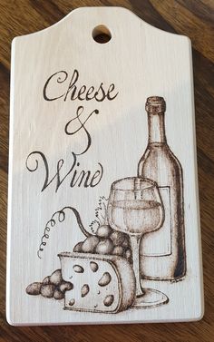 a wooden sign that says cheese and wine