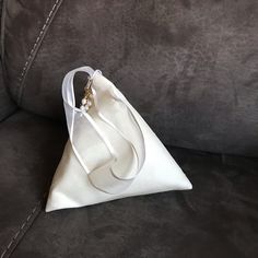 Nwt Bridal Handbag Zip Opening With Pearl Accent. 7” Pyramid Shape. Matching Satin Liner, Zipper, And Sheer Ribbon Handle. Never Used. Smoke Free, Pet Free Home. Mcm Clutch, Bridal Handbag, Navy Blue Clutch, Burgundy Clutch, Kate Spade Clutch, Pyramid Shape, Bridal Handbags, Louis Vuitton Neverfull Monogram, Blue Clutch