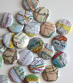 a bunch of buttons that are sitting on a table with the words new york in them