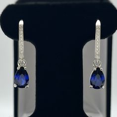 Gorgeous Pear Cut Sapphire Leverback Earrings  * Pear Cut Blue Sapphires measure 9mm x 6mm each * Brilliant Cut Cubic Zirconia Accented Leverback fasteners  * 3.6cts total gemstone weight * 1 & 1/8 inch in length each (approx 29mm) * Solid Sterling Silver Hallmarked & Gift Ready! These Sapphires are laboratory grown stones. They are identical to the genuine stone in every way, including chemistry, composition and hardness, with an outstanding cut, clarity and color refraction. Matching Pendant a Trending Jewelry, Fine Art Jewelry, Leverback Earrings, Pear Cut, Art Jewelry, Jewelry Gift, Jewelry Art, Blue Sapphire, Sterling Silver Earrings