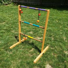 an outdoor game set made out of wooden sticks and balls