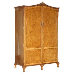 an antique wooden armoire with two doors