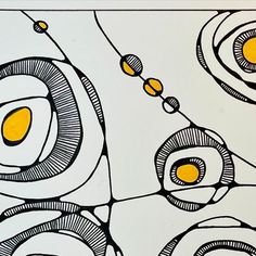 an abstract painting with yellow and black circles