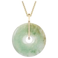 Jade Donut Pendant with Diamonds in 18k Yellow Gold, from 'G-One' Collection Stone size: 50 mm Diamond: G-H / VS, Approx Wt: 0.10 Carats Luxury Round Stone Work Jewelry, Luxury Polished Finish Jewelry With Round Stone, Luxury Polished Round Stone Jewelry, Luxury Jade Necklaces For Meditation, Jade White Gold Necklace, Luxury Jade Pendant Necklace, Luxury Jade Pendant Necklaces, Luxury Jade Fine Jewelry Necklace, Luxury Round Bead Jade Jewelry