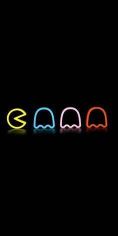 four different colored neon lights in the shape of headbands on a black background