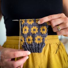 a woman is holding an object in her hands