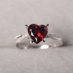 ◆ The ring is handcrafted from sterling silver and decorated with a dazzling 8*8 mm Garnet and CZs. It is suitable for engagement/anniversary/daily occasion. ◆ Production Description: Main stone Type: Garnet Main Stone Shape: Heart Cut Main Stone Size: 8*8 mm(2.44ct) Side stone: CZ Metal: 925 Sterling silver - Other options available in the drop down menu ◆ Customization: √Free for Add Engraving √Other Metal Type Available √Other Gemstones & Shapes Available √Personalization Requests Availab Moissanite Heart Cut Diamond Ring For Proposal, Heart Cut Moissanite Diamond Ring For Proposal, Diamond White Promise Jewelry For Valentine's Day, Diamond Heart Cut Ring For Proposal, Anniversary Ruby Ring With Moissanite In Round Cut, Anniversary Ruby Ring With Round Cut Moissanite, Valentine's Day Solitaire Diamond Jewelry, Luxury Diamond Ring With Gemstone For Valentine's Day, Heart-shaped White Gold Birthstone Ring For Valentine's Day