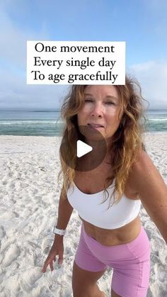 a woman is standing on the beach with a sign above her head that says, one movement every single day to age gracefully