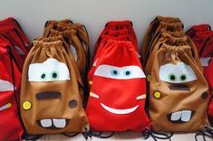 four bags with cars on them sitting next to each other