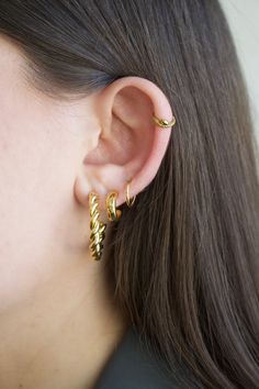 You'll want to sweep your hair high and let your cartilage show with our snake hoop earring.  Material: 316L Surgical steel OR 316L Surgical steel + quality PVD tarnish-resistant plating Gauge: 16g (1.2 mm) Size (length/diameter): 8mm (standard size) OR Size (length/diameter): 10mm  Most suitable for: Cartilage, daith, rook, nose hoop, septum, earlobe  How to put on/remove: Hinged clicker hoop, making it easy to take on and off ** This item is final sale due to hygienic purposes we cannot accept Trendy Small Hoop Single Ear Cuff, Trendy Hoop Ear Cuff For Pierced Ears, Trendy Hypoallergenic Hoop Ear Cuff, Trendy Hoop Ear Cuff With Piercing, Trendy Single Hoop Cartilage Earring, Spiral Ear Cuff, Internally Threaded Hoop Huggie Earrings, Helix Hoop Earring, Helix Earrings Hoop