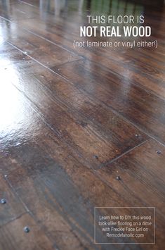 a wood floor with the words, this floor is not real wood not laminate or vinyl either