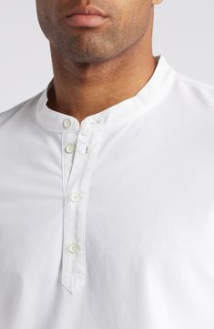 This cotton henley is made with a plenty of stretch and designed in a fit that's easy to layer or wear on its own. 28" length (size Medium) Button half placket Crewneck Long sleeves 87% cotton, 13% spandex Machine wash, tumble dry Imported Classic Crew Neck Henley With Button Closure, Classic Cotton Henley For Spring, White Cotton Henley With Buttons, Classic Henley With Button Closure, Classic Crew Neck Henley With Buttons, Classic Fitted Tops With Henley Neckline, Classic Cotton Henley With Buttons, Classic Cotton Henley, Classic Cotton Henley For Everyday