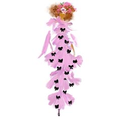 a drawing of a woman with flowers on her head and pink feathers hanging from it's back