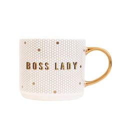 a white and gold mug with the words boss lady on it